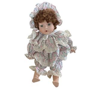 Porcelain Doll - tb Trading Company Red/ Brown  with Green Eyes Sitting